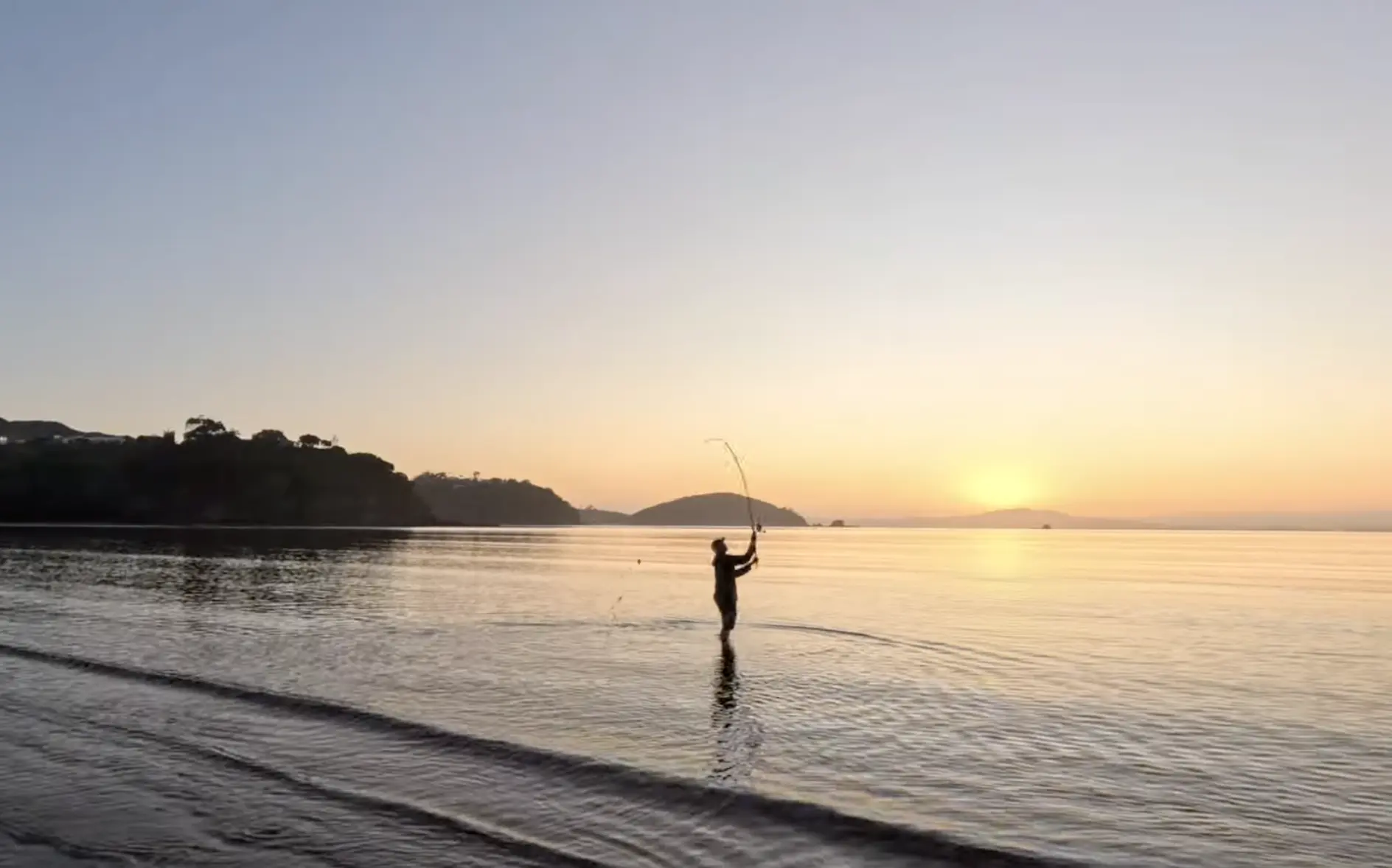 fisherman fishing at high tide 