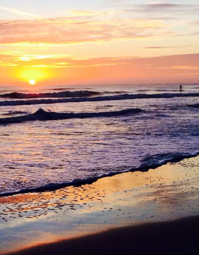 Paddle board into the surf