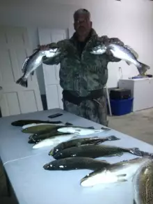 My brother holding some specks we caught on one of our recent trips