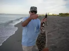 Beach fishing for flounder in Venice FL.