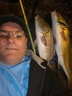 My son caught one slot red fish and so did I On live select shrimp